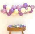 Purple and pastel yellow balloon garland