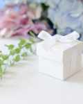 white favour boxes with ribbon